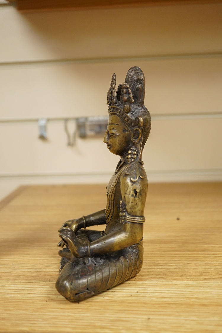 A Nepalese bronze seated figure of Avalokiteshvara, 19th century, 18cm high